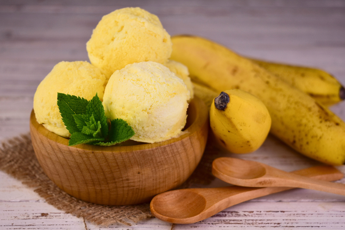 Banana homemade ice cream. Balls of banana ice cream with mint.
